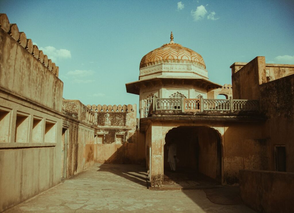 Stunning view of historic Mughal architecture with a dome in Jaipur, India, showcasing rich heritage.